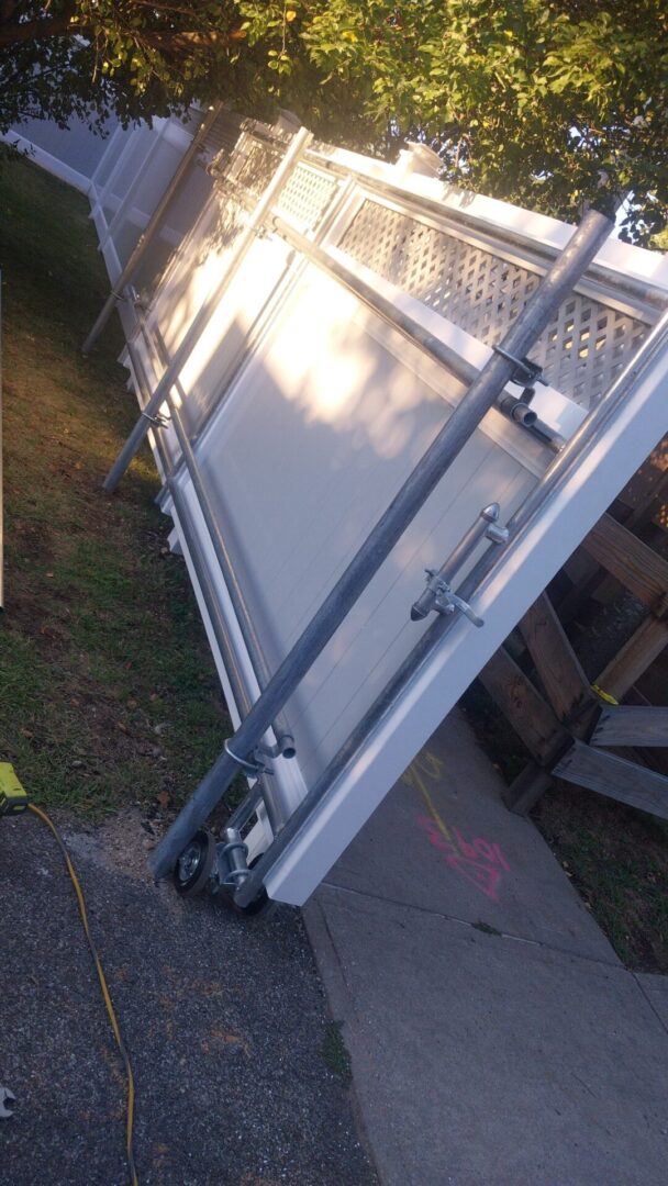 Close-up of a metal gate hinge and latch mechanism.