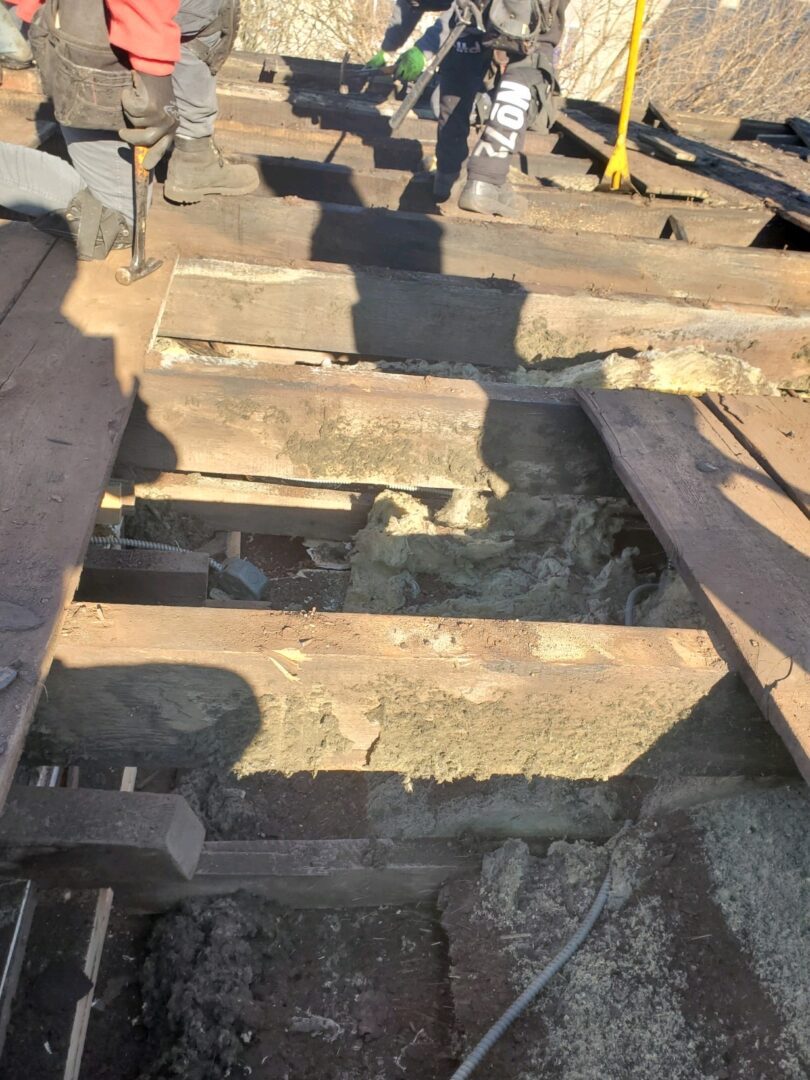 Old, weathered wooden beams and rusty metal parts.