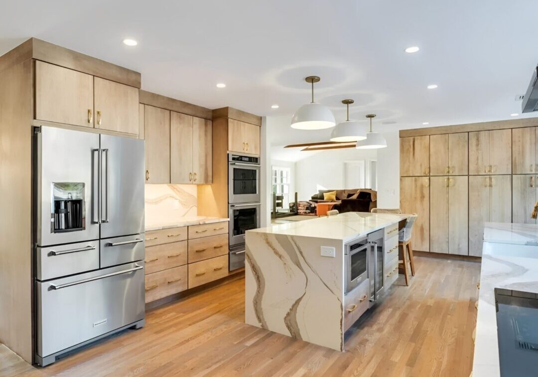Spacious kitchen with marble waterfall island